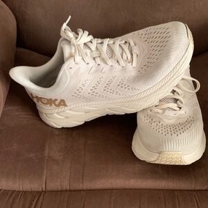 Hoka Cream and Gold Athletic Shoes